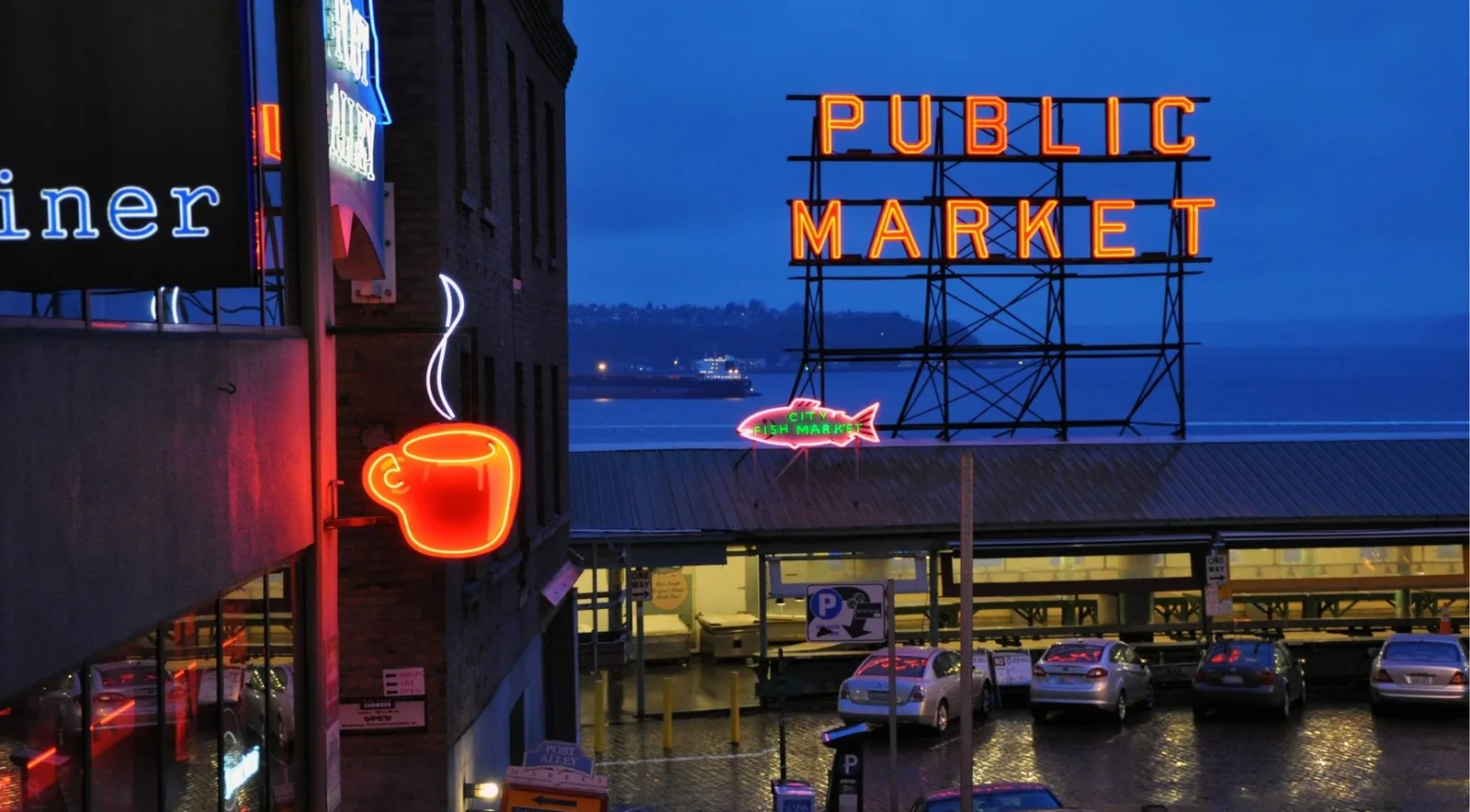 The iconic Public Market neon sign at Pike Place at dusk