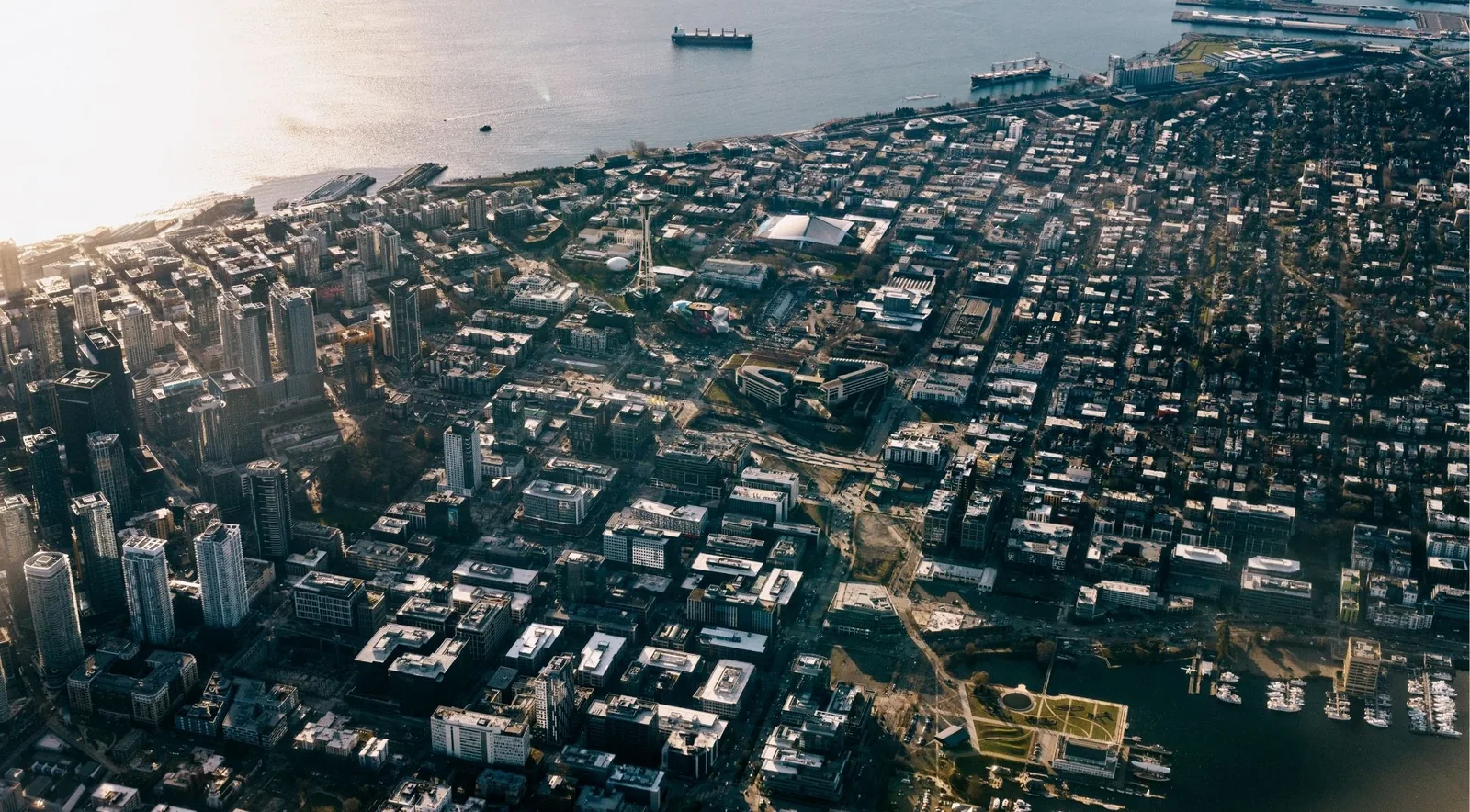 Aerial view of downtown Seattle's grid meeting the waterfront
