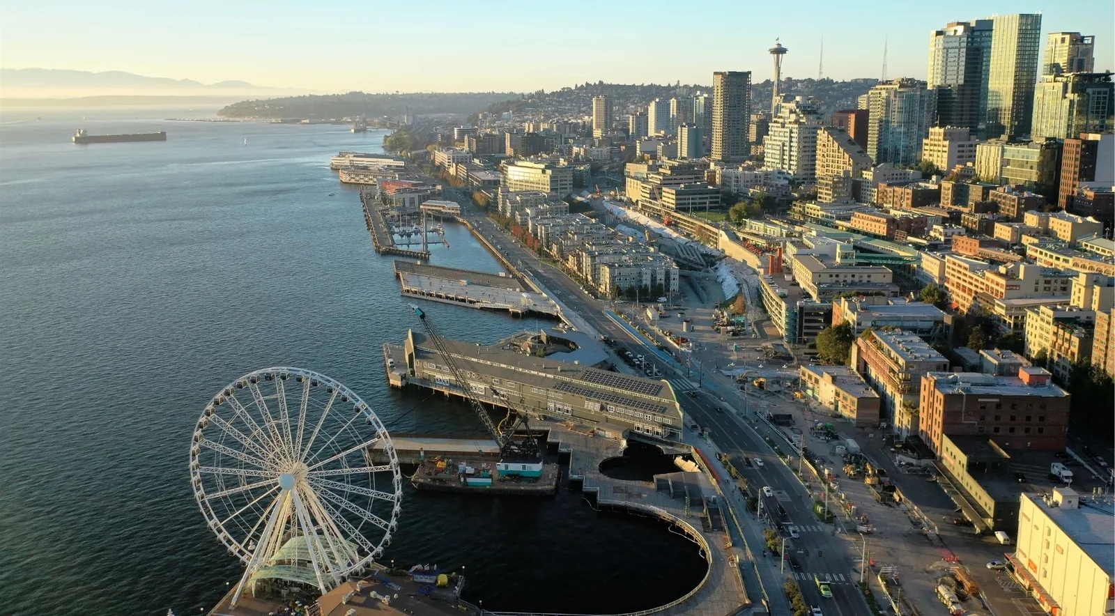 Aerial view of the Seattle waterfront piers and the Great Wheel at sunrise