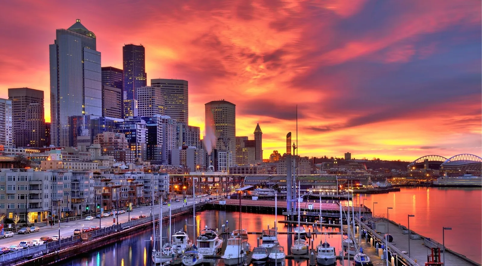 Vivid sunset over the Seattle waterfront, marina and downtown skyline